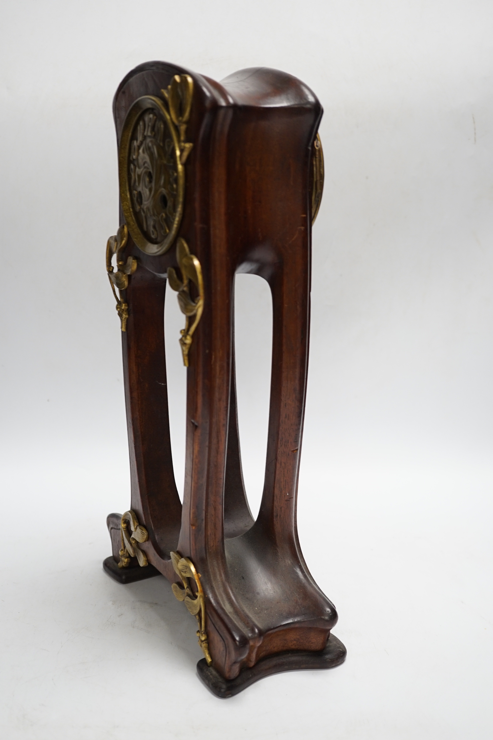 A French Art Nouveau mahogany and brass-mounted mantel clock, 39cm